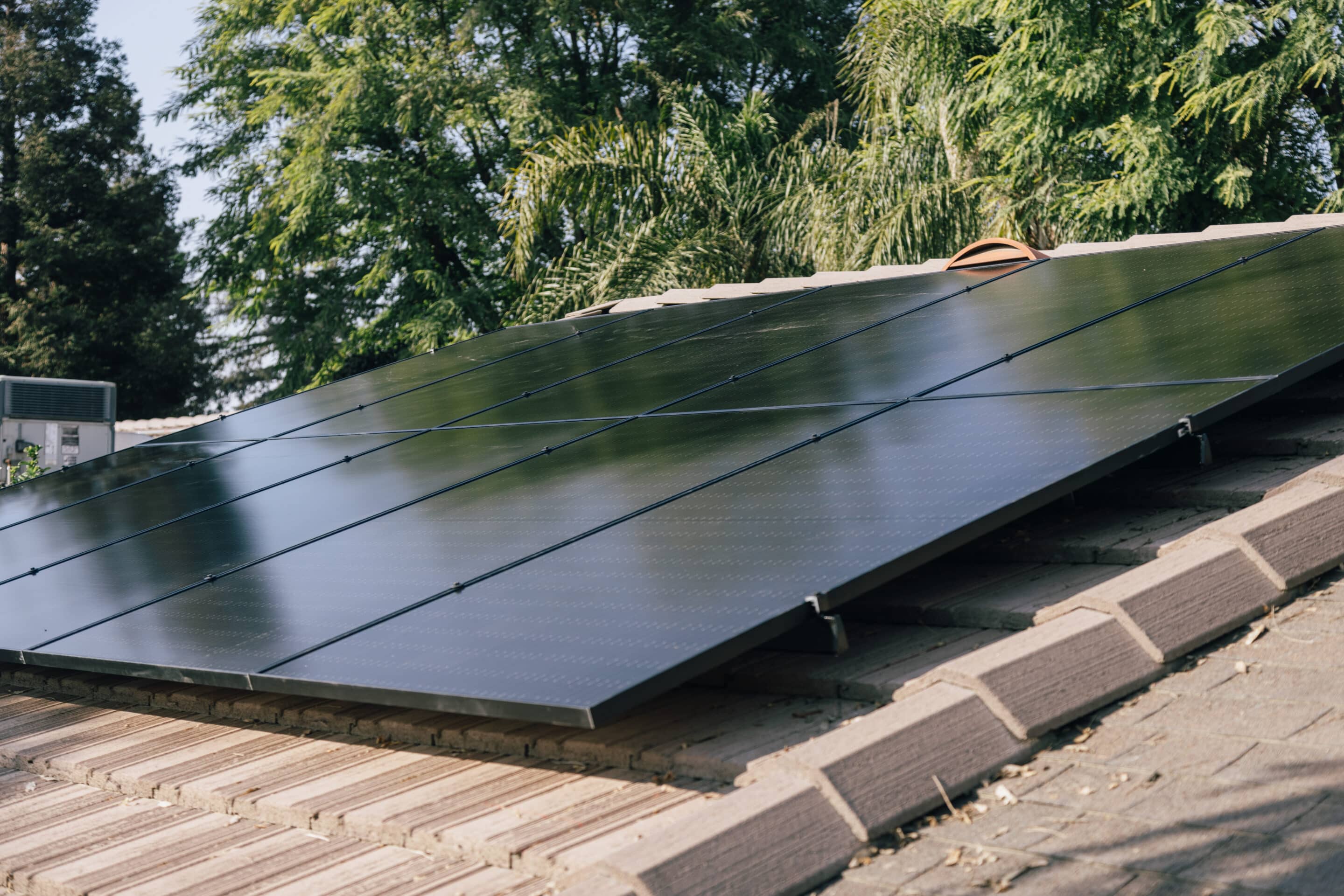 solar installers on a roof